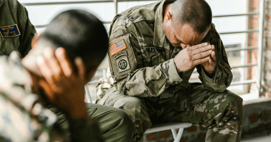 Soldiers in group therapy session, addressing PTSD and CPTSD. Military personnel seeking mental health support. Overcoming trauma.