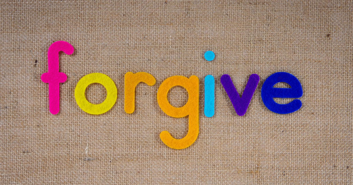 JULY-BLOG IMAGES 72 - San Jose Mental Health Brightly colored letters spell 'forgive' on a burlap background.